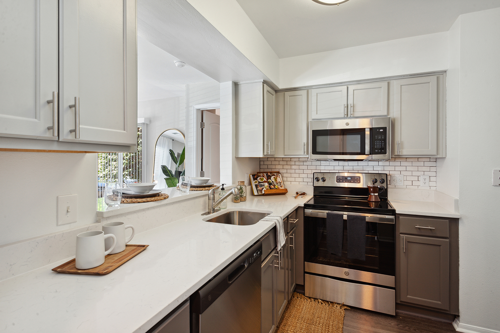 luxury crofton apartment kitchen with stainless steel appliances and grey cabinets